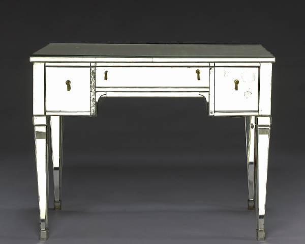 Appraisal: An Art Moderne mirrored vanity circa The rectangular top over