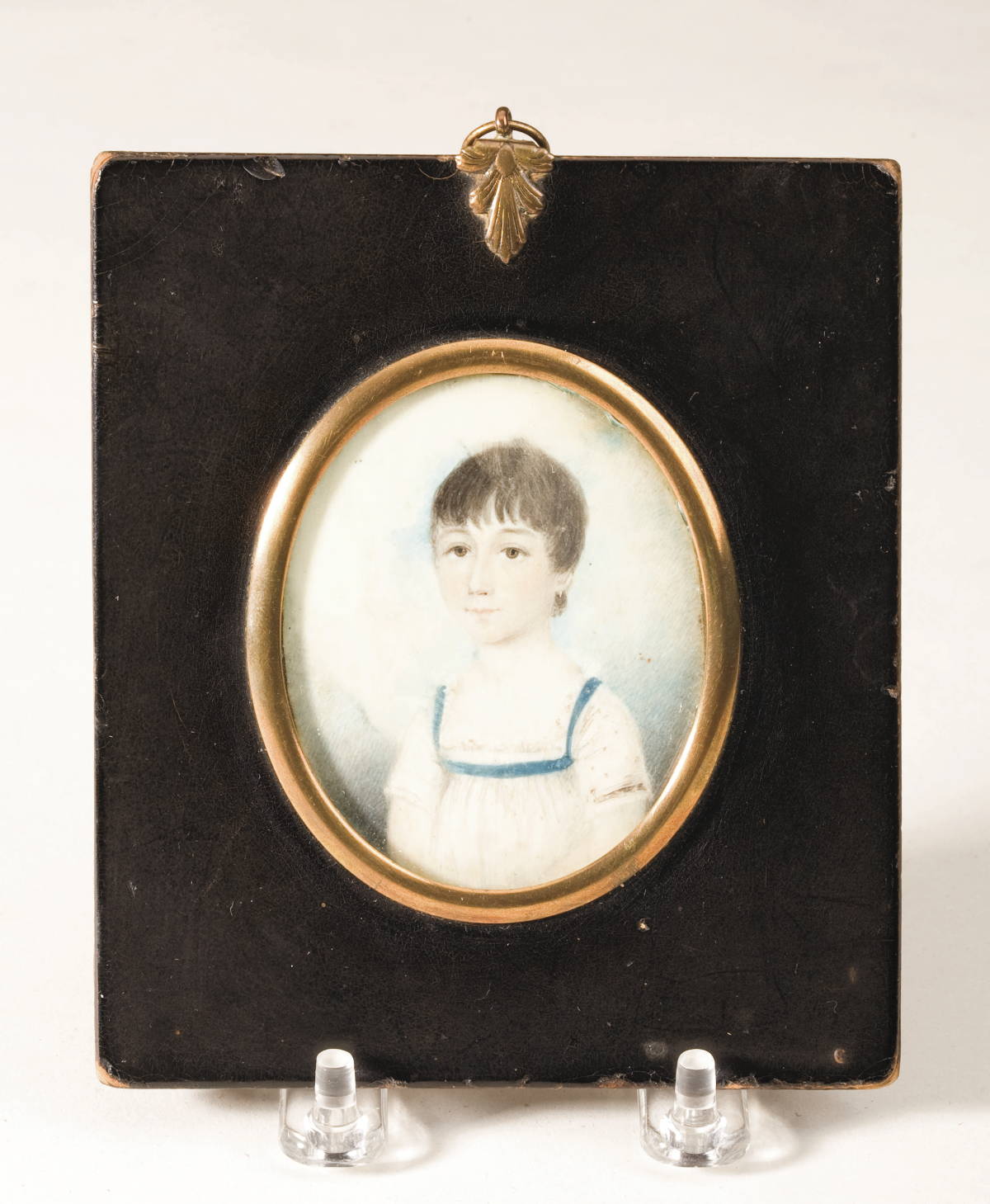 Appraisal: MINIATURE IVORY PORTRAIT OF A CHILD IN RED DRESS AND