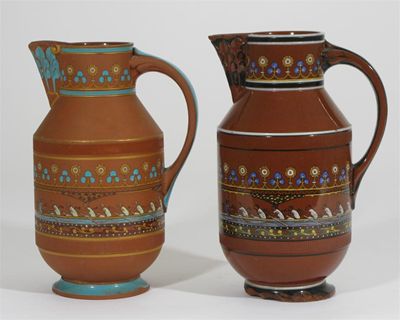 Appraisal: Two rare Watcombe Pottery Boat Race terracotta jugs designed by