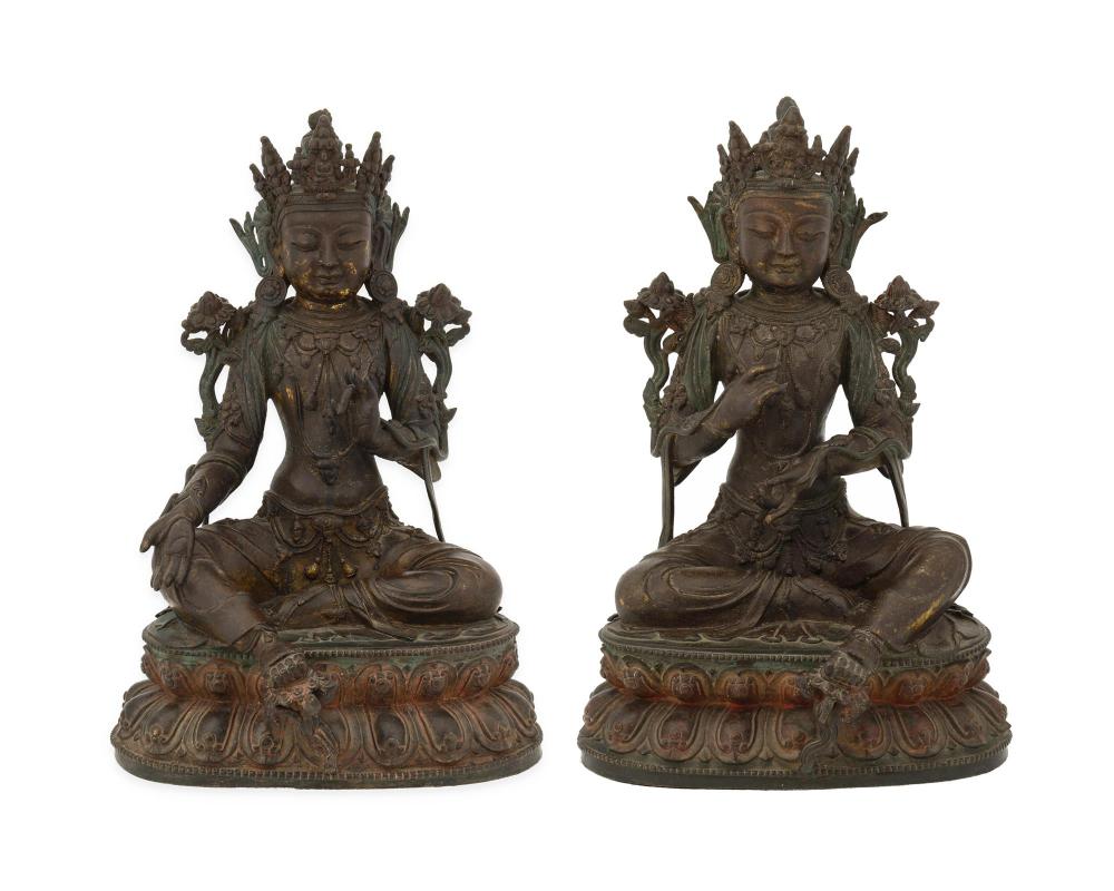 Appraisal: A pair of Buddhist devotional figures th Century Each depicting