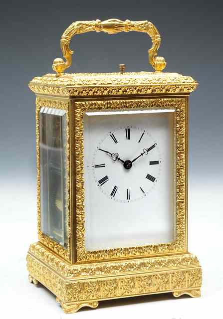 Appraisal: A FRENCH CARRIAGE CLOCK with white enamel Roman dial pinwheel