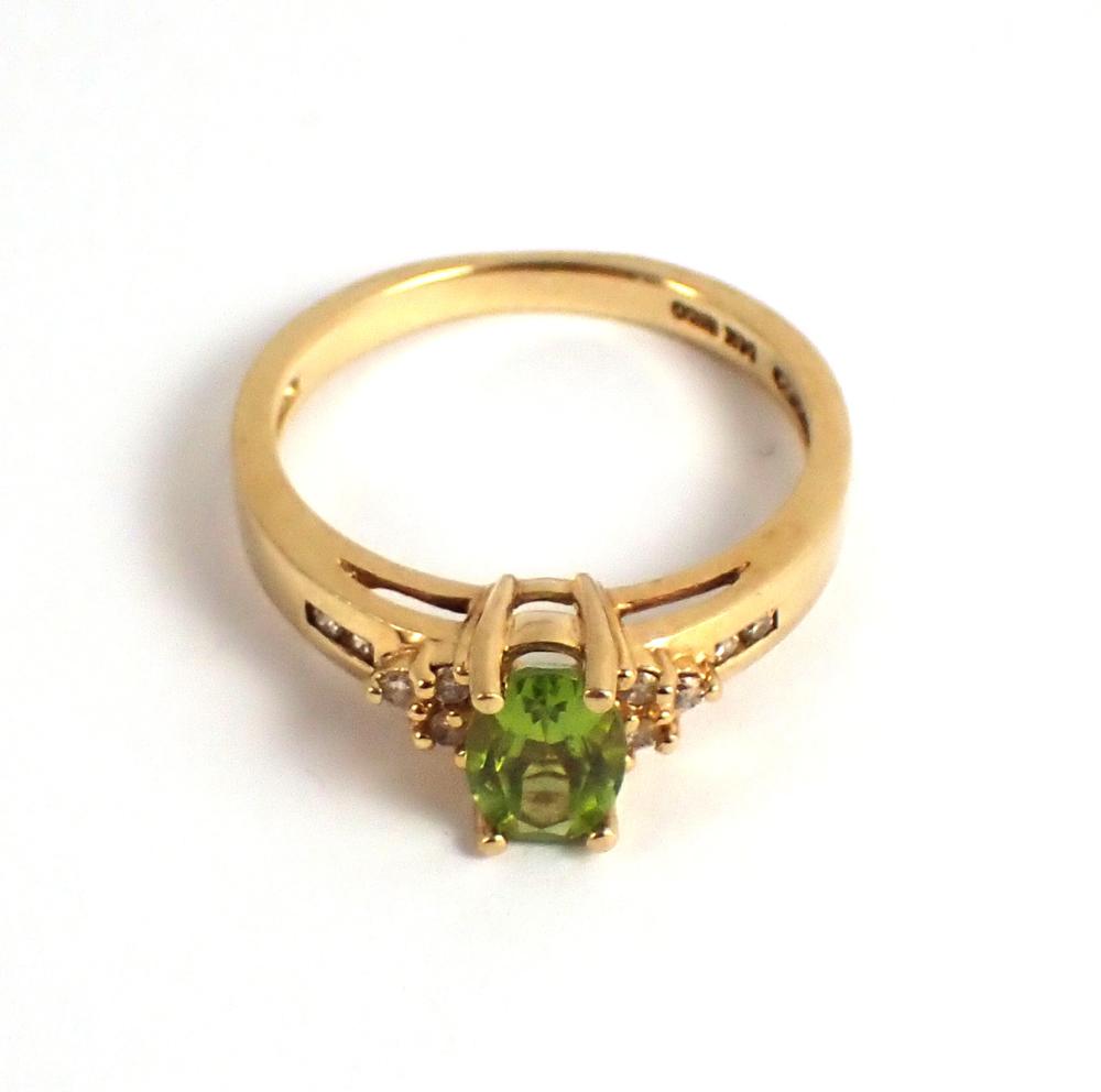 Appraisal: PERIDOT DIAMOND AND FOURTEEN KARAT GOLD RING The k yellow