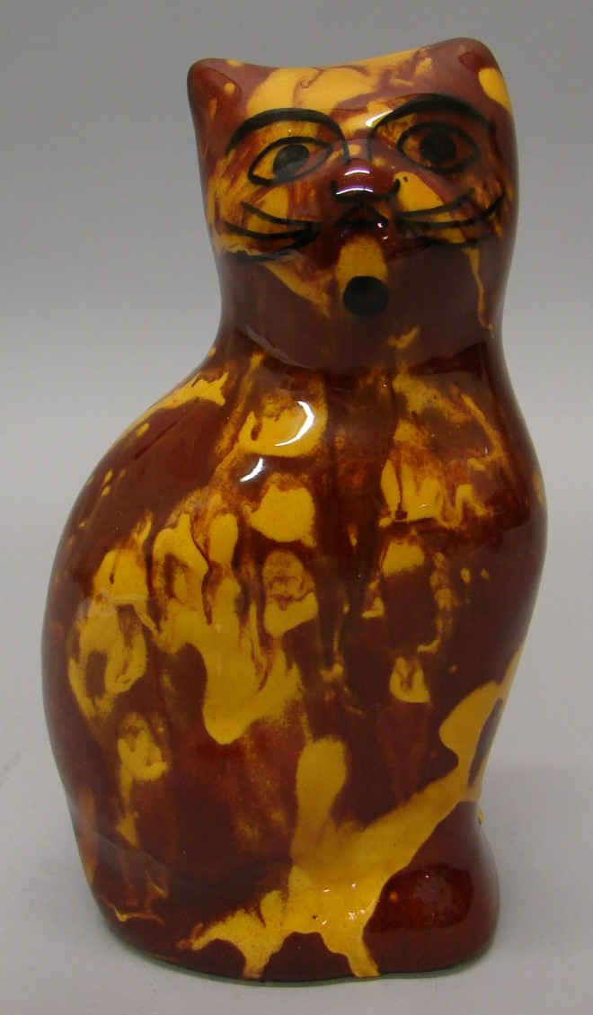 Appraisal: Cat - molded brown yellow tall - N Foltz