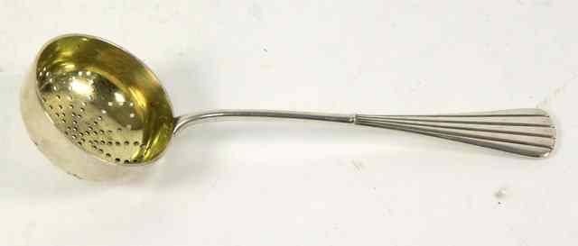 Appraisal: A Russian silver tea strainer Carl Faberge Moscow - with