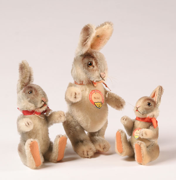 Appraisal: Steiff Niki bunnies all with ear buttons fabric collars and