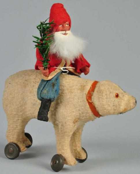 Appraisal: Santa Riding Polar Bear Pull Toy Description Glass eyes and