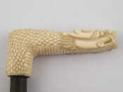 Appraisal: A Chinese carved ivory parasol handle designed as a dragon