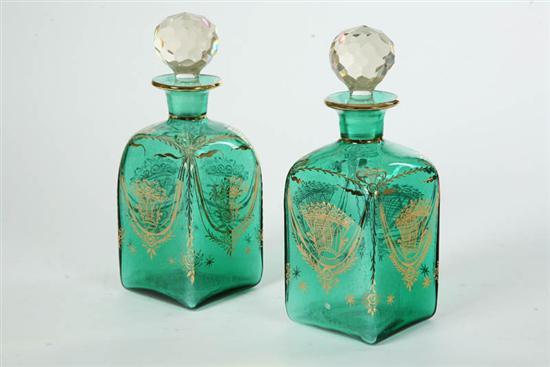 Appraisal: TWO GLASS DECANTERS Square rounded decanters in olive with flared