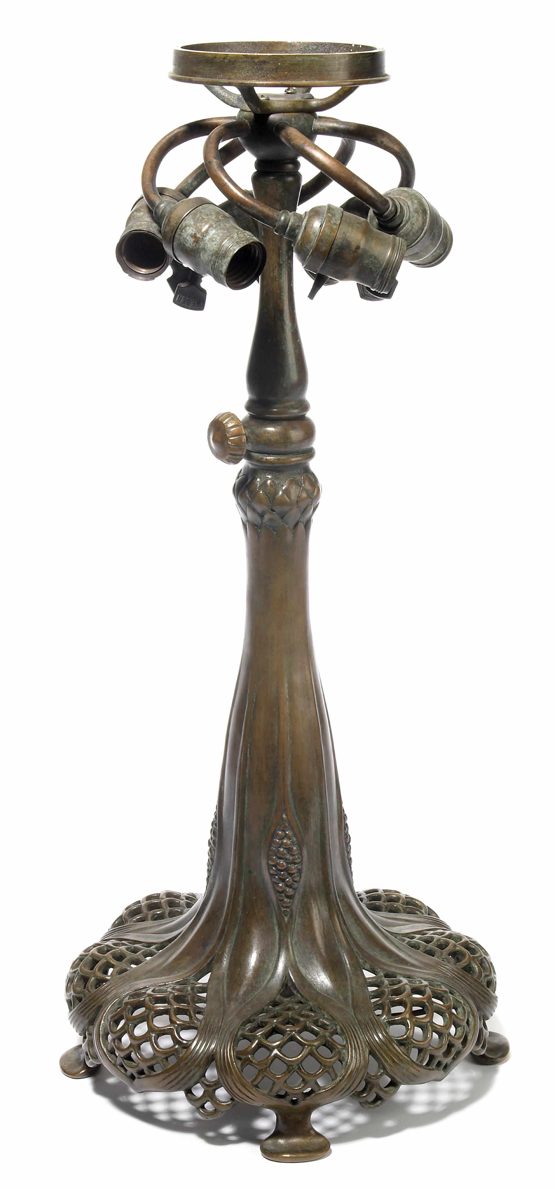 Appraisal: An American patinated bronze telescoping reticulated table lamp base spuriously