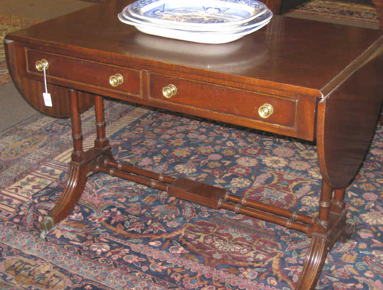 Appraisal: ENGLISH SHERATON STYLE MAHOGANY SOFA TABLE The oval twin flap