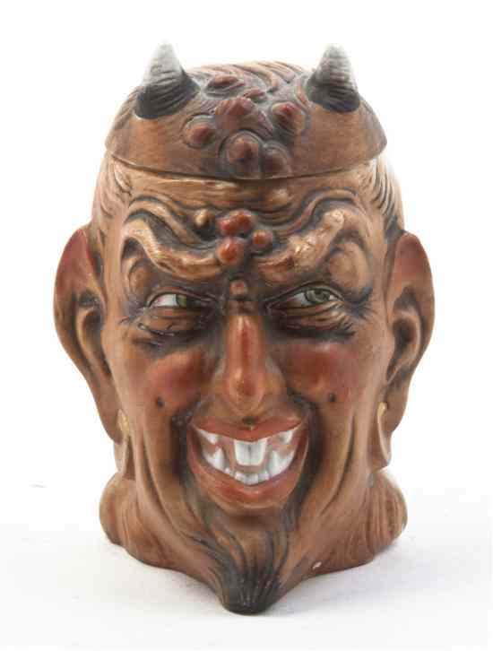 Appraisal: A Ceramic Figural Tobacco Jar depicting the devil impressed Height