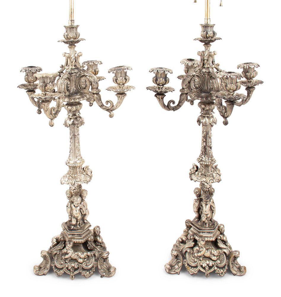 Appraisal: A Pair of Silvered Cast Metal Candelabra Mounted as Lamps