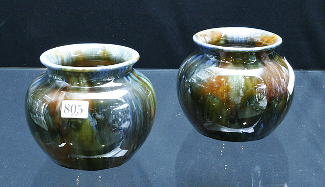 Appraisal: A pair of Australian pottery glazed vases in compressed globular