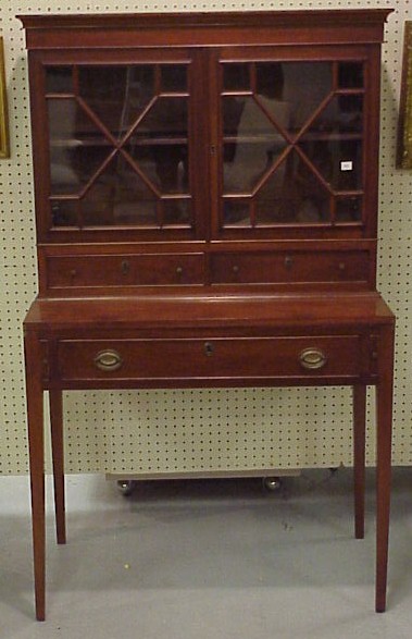 Appraisal: Lady's mahogany desk with bookcase two glazed doors over tandem