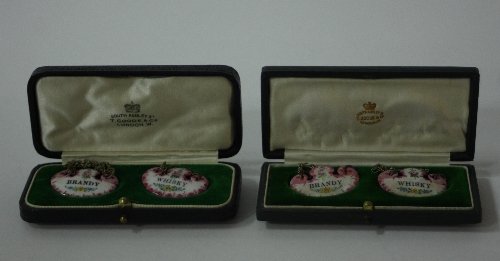 Appraisal: Two pairs of enamelled spirit labels Brandy and Whisky each