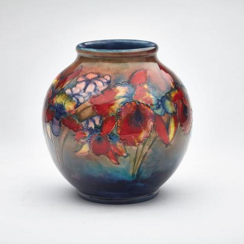 Appraisal: Moorcroft Flamb Orchids Vase s the ovoid body painted with