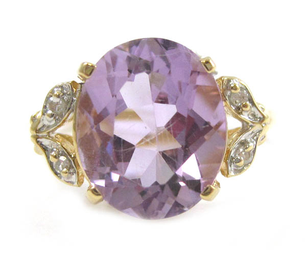 Appraisal: AMETHYST DIAMOND AND FOURTEEN KARAT GOLD RING with two round-cut