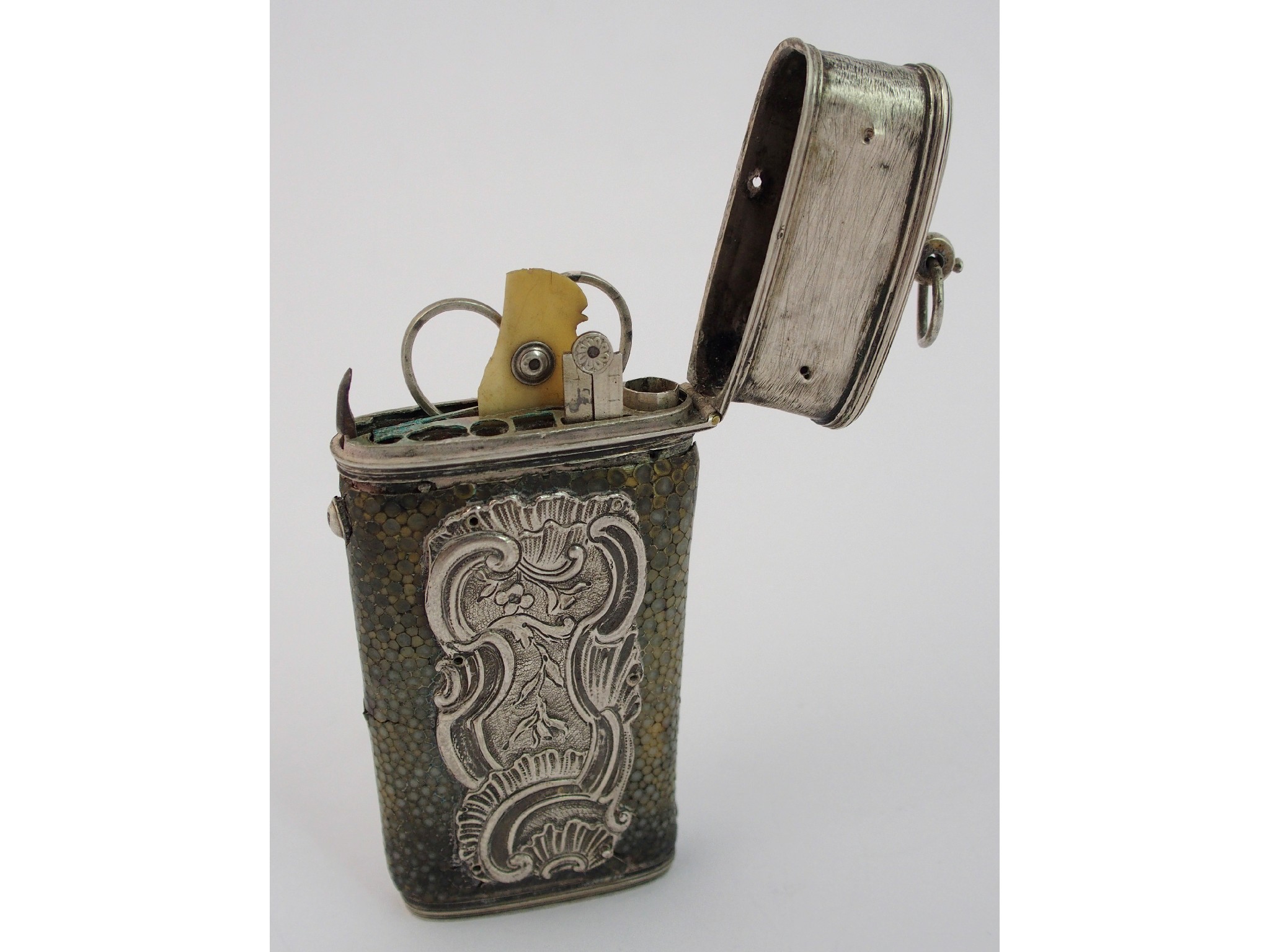 Appraisal: A white metal and shagreen etuithe pushbutton operated hinged cover