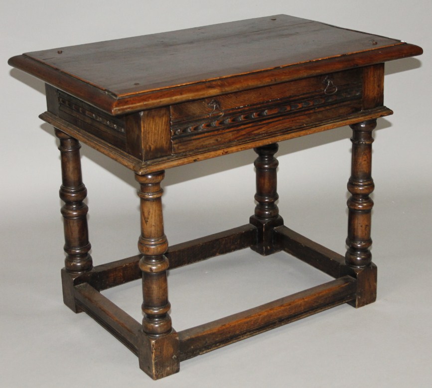 Appraisal: A Continental oak side table the planked top with a