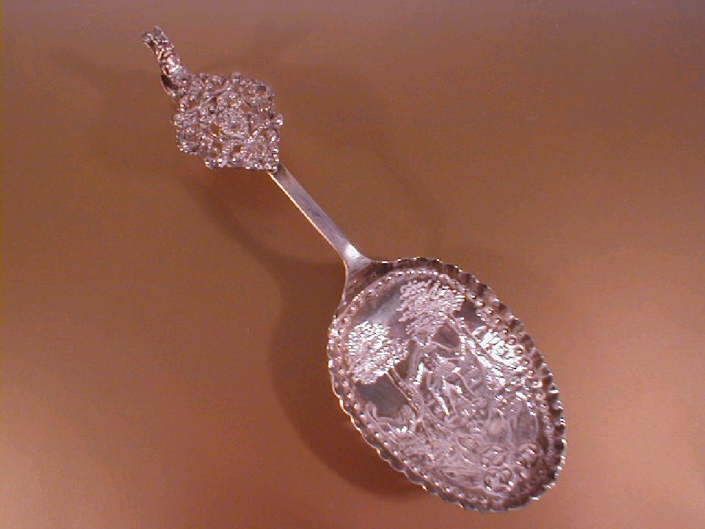 Appraisal: A late thC Dutch silver tablespoon with landscape embossed bowl