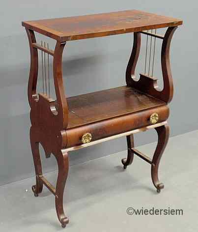 Appraisal: Philadelphia Classical mahogany lyre-form table with a single drawer As