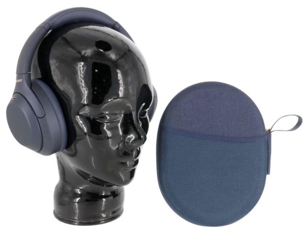 Appraisal: Sony dark blue noise canceling headphones with case for shipping