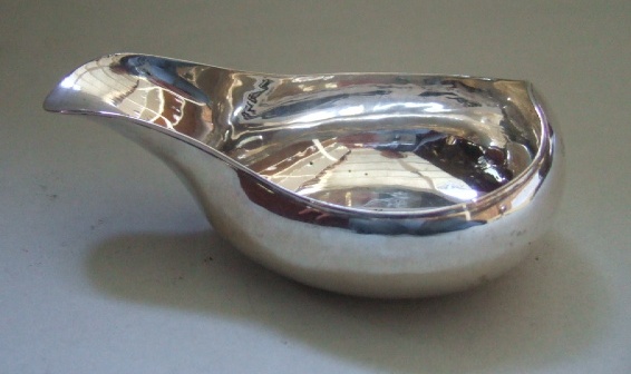 Appraisal: A silver pap boat with a reeded rim London probably