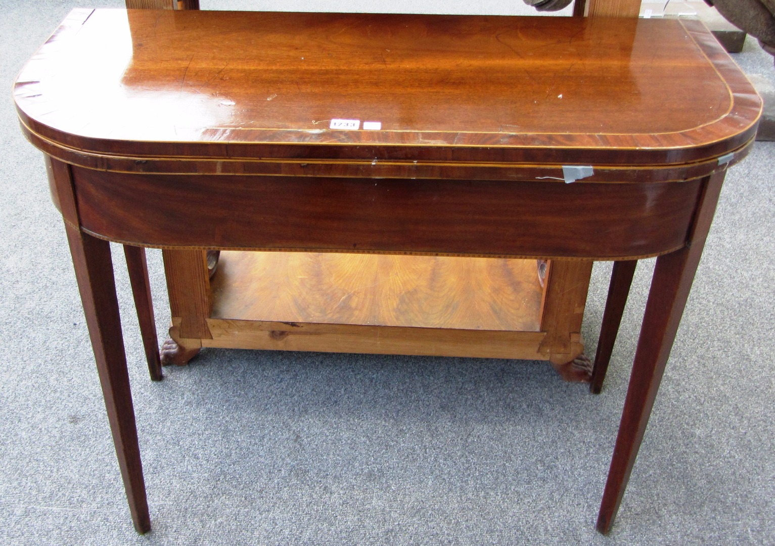 Appraisal: A George III inlaid mahogany card table on tapering square