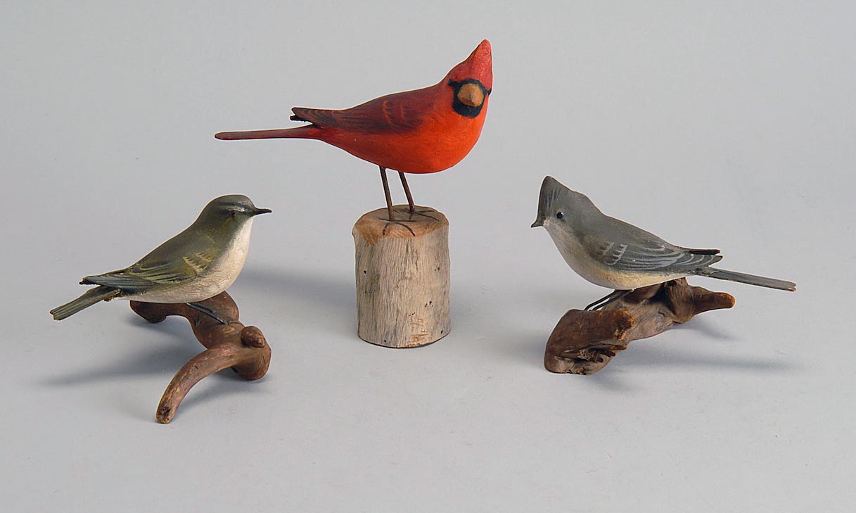 Appraisal: THREE LIFE-SIZE SONGBIRDS A cardinal a red-eyed wren with damaged