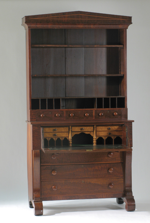 Appraisal: EMPIRE MAHOGANY AND BURL WALNUT BOOKCASE ON SECRETARY CHEST late