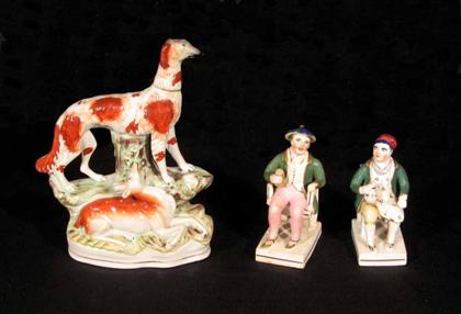 Appraisal: Three Staffordshire figures comprising a dog and two seated male