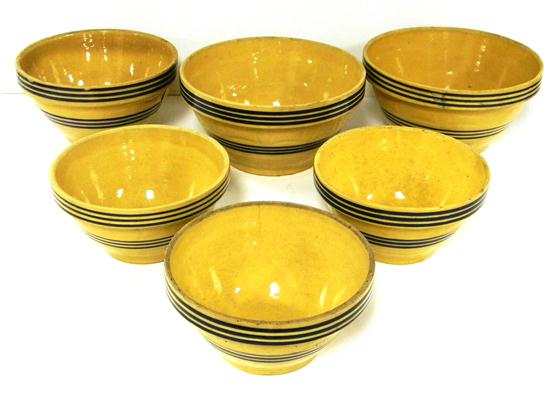 Appraisal: Six yellow ware blue striped bowls some roughness and chips