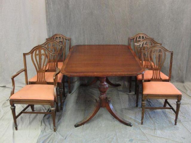 Appraisal: Mahogany Twin Pedestal Banded Dining Table Chairs Some chairs as