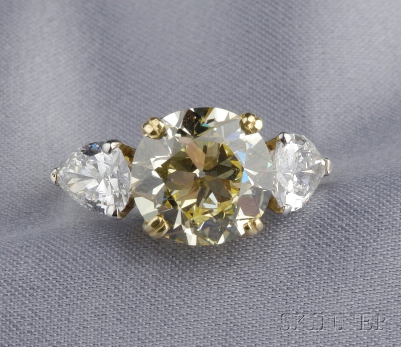 Appraisal: Fancy Yellow Diamond and Diamond Solitaire Verdura prong-set with a