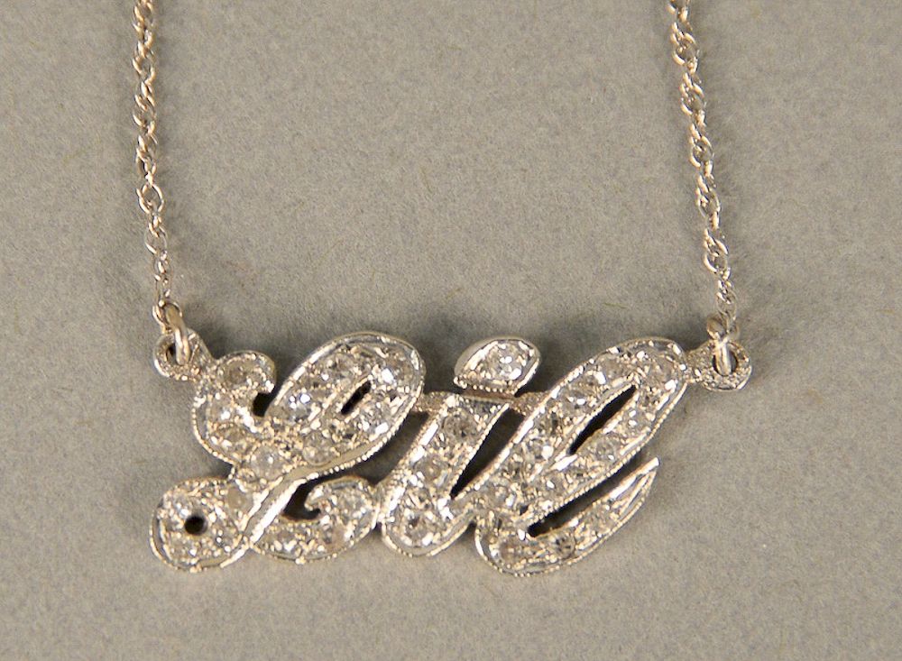 Appraisal: karat white gold chain with Lil pendant set with diamonds