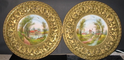 Appraisal: PAIR OF FRENCH PORCELAIN SCENIC CHARGERS each with a decorated