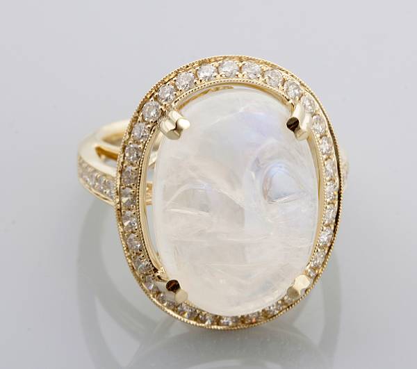 Appraisal: property of various owners centering a moon-face carved moonstone