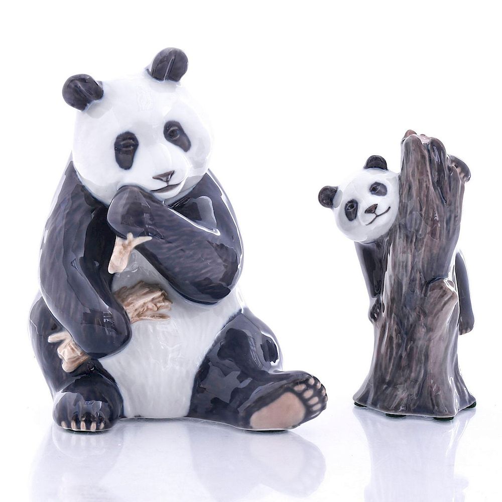 Appraisal: ROYAL COPENHAGEN PANDAS FIGURINE Panda eating bamboo and climbing a