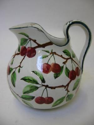 Appraisal: A LARGE WEMYSS POTTERY JUG of squat baluster form painted