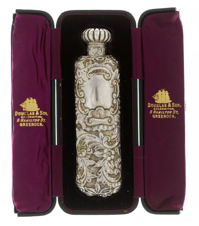 Appraisal: A VICTORIAN SILVER SCENT BOTTLE richly embossed with flowers and