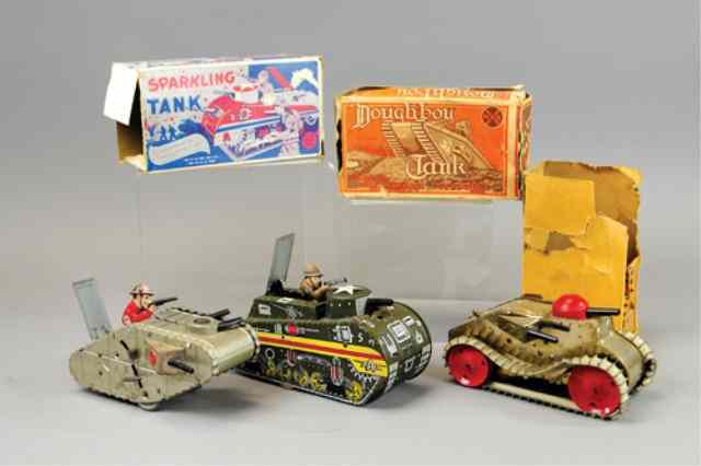 Appraisal: LOT OF THREE MARX TANK TOYS Lithographed tin classic climbing