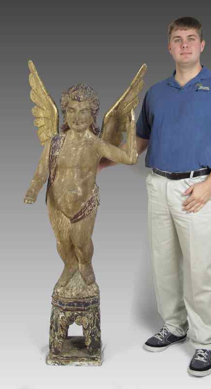 Appraisal: EUROPEAN CARVED AND PAINTED ANGEL th C carving with distressed