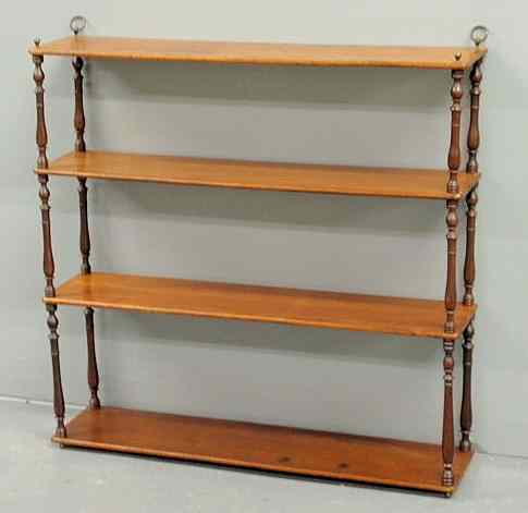 Appraisal: Delicate English mahogany hanging shelf the four shelves supported by