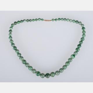 Appraisal: A Graduated Green Jade Beaded Necklace A Graduated Green Jade