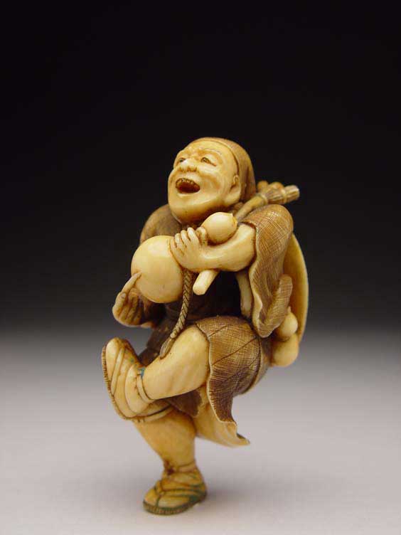 Appraisal: CARVED IVORY NETSUKE Very finely carved and stained contemporary ivory