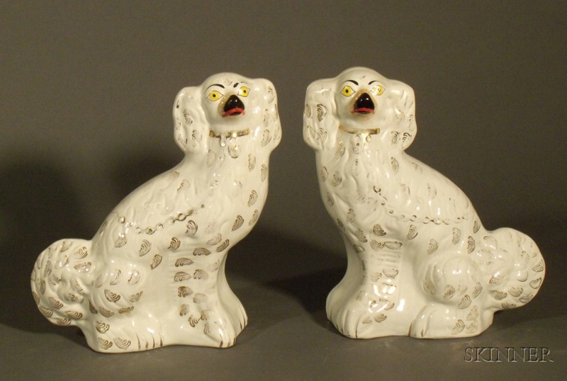 Appraisal: Pair of Staffordshire Pottery Spaniels England th century white ground