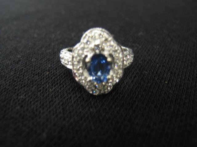 Appraisal: Sapphire Diamond Ring oval carat gem surrounded by diamonds totaling