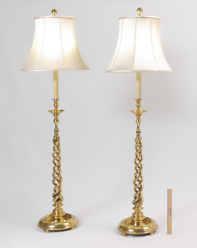 Appraisal: PAIR BRASS DOUBLE TWIST FLOOR LAMPS All brass bodies with