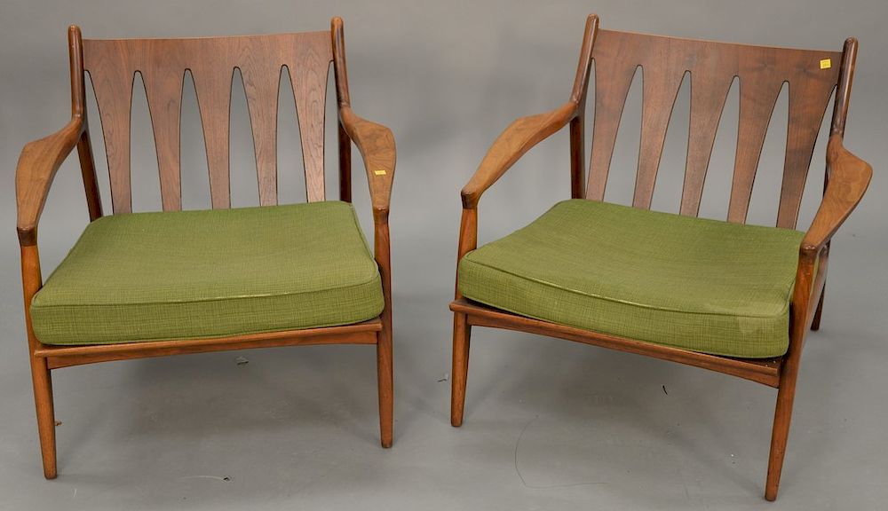 Appraisal: Pair of Kofod Larsen armchairs dry seat cushions Pair of