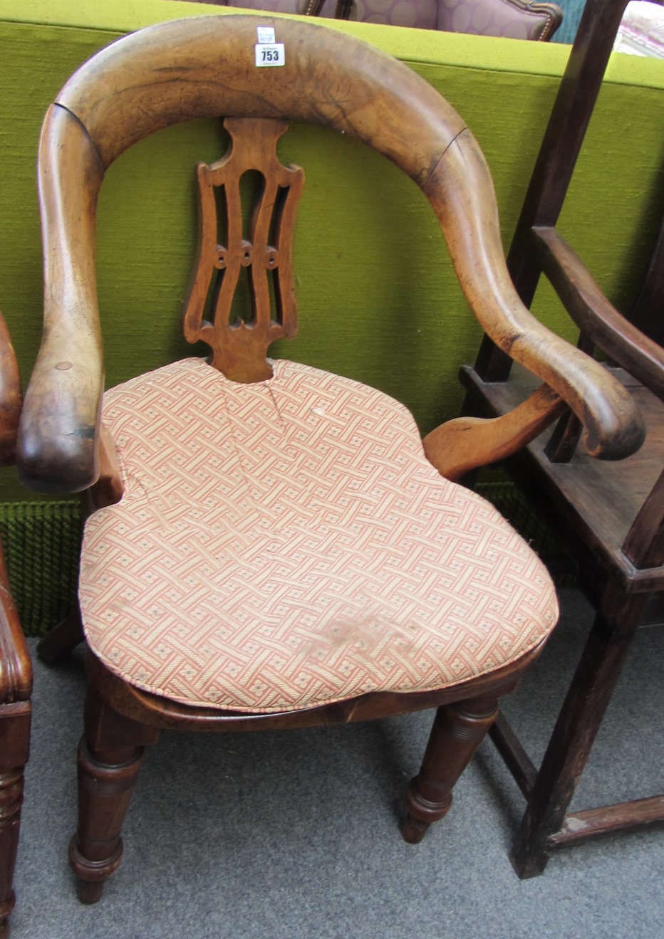 Appraisal: A Victorian mahognay tub back desk chair on turned supports